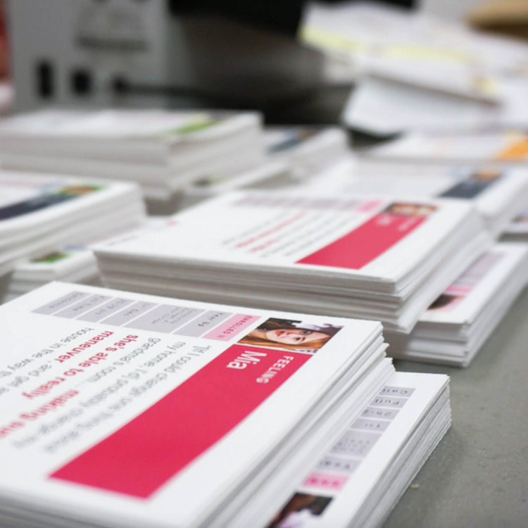 Stacks of printed persona cards on a table